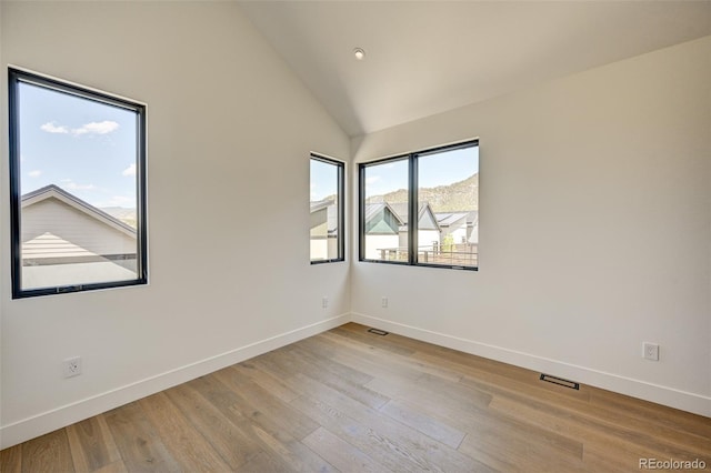 414 E Arkansas St, Buena Vista, CO 81211 - empty room featuring wood finished floors, lofted ceiling, and recessed lighting