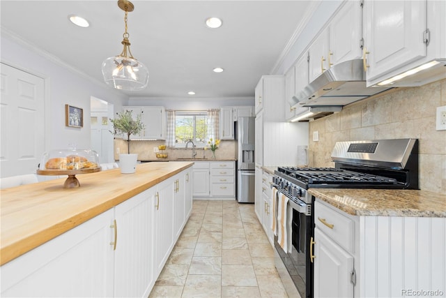 kitchen featuring appliances with stainless steel finishes, under cabinet range hood, white cabinets, recessed lighting, and crown molding