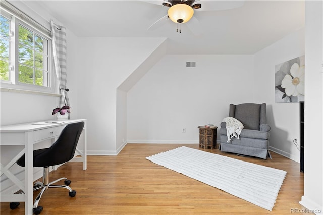 office area featuring a ceiling fan, wood finished floors, and baseboards