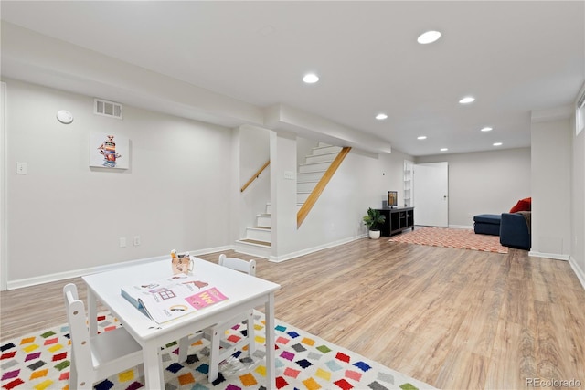 playroom featuring wood finished floors, recessed lighting, and baseboards