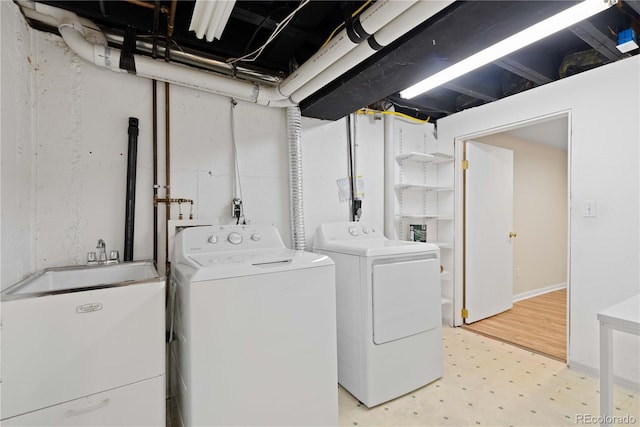 washroom featuring tile patterned floors and washing machine and dryer