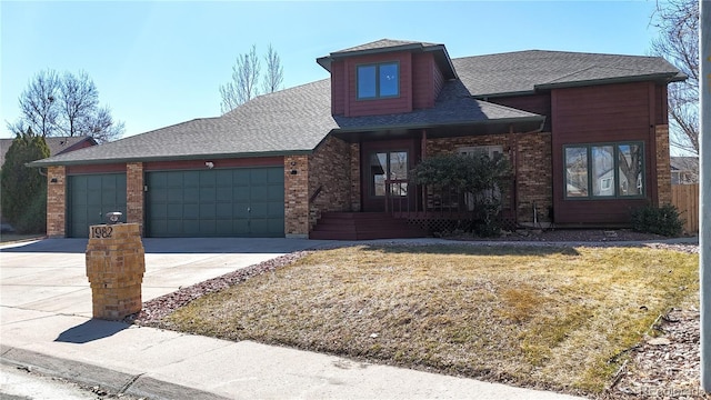 view of front of house featuring driveway, brick siding, an attached garage, and a shingled roof