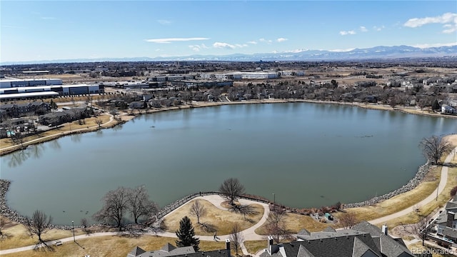 drone / aerial view with a water and mountain view