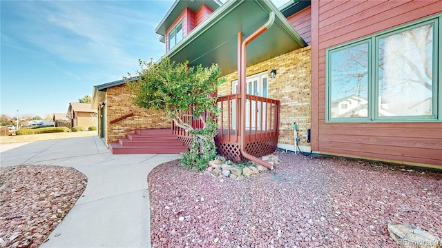 view of home's exterior featuring brick siding