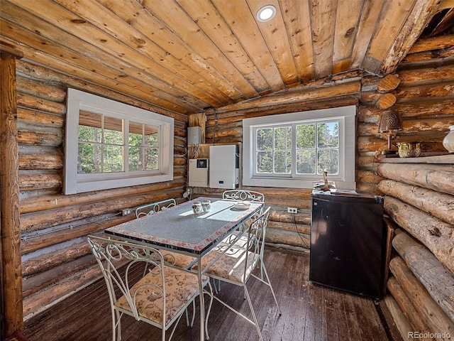 dining room featuring log walls, vaulted ceiling, recessed lighting, dark wood finished floors, and wood ceiling