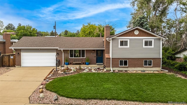 10009 Dodge Dr, Northglenn, CO 80260 - split level home featuring a garage, brick siding, a front yard, and concrete driveway