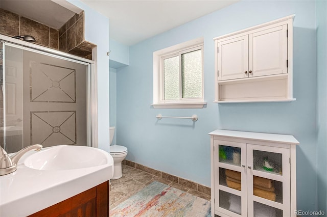 10009 Dodge Dr, Northglenn, CO 80260 - bathroom featuring a shower with door, vanity, and tile patterned flooring