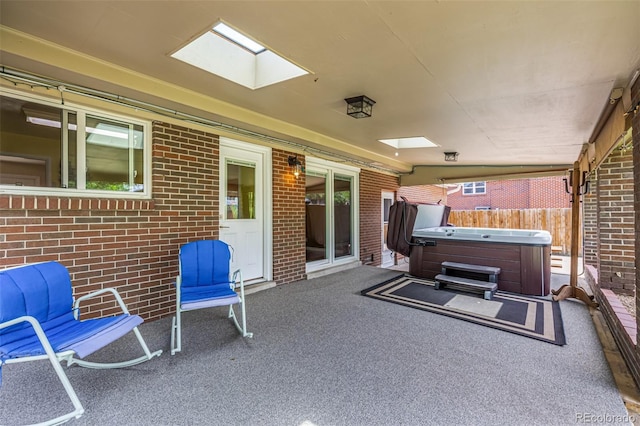 10009 Dodge Dr, Northglenn, CO 80260 - view of patio with a hot tub