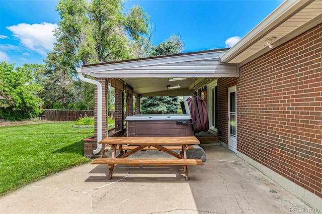 10009 Dodge Dr, Northglenn, CO 80260 - view of patio featuring a hot tub