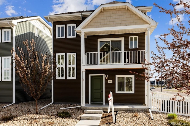 5383 Andes St, Denver, CO 80249 - view of front of house featuring a balcony and a porch