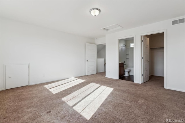 5383 Andes St, Denver, CO 80249 - unfurnished bedroom with attic access, carpet floors, ensuite bathroom, and a spacious closet
