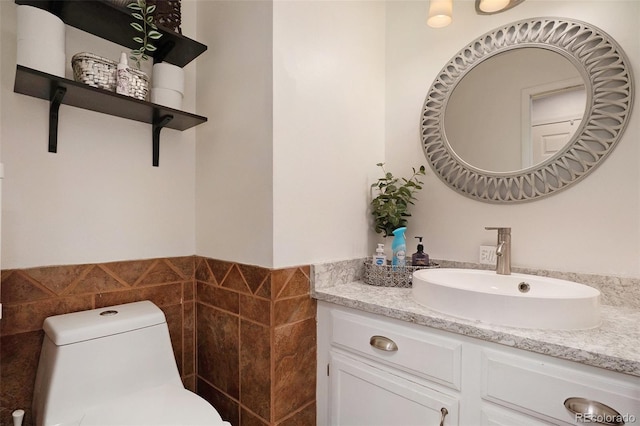 bathroom with toilet and vanity