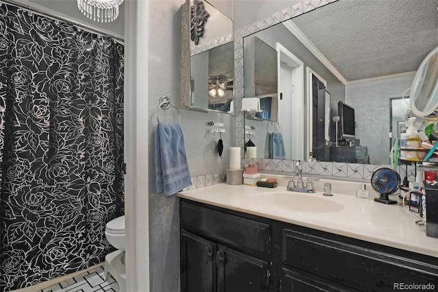 full bath with vanity, a textured ceiling, crown molding, and toilet