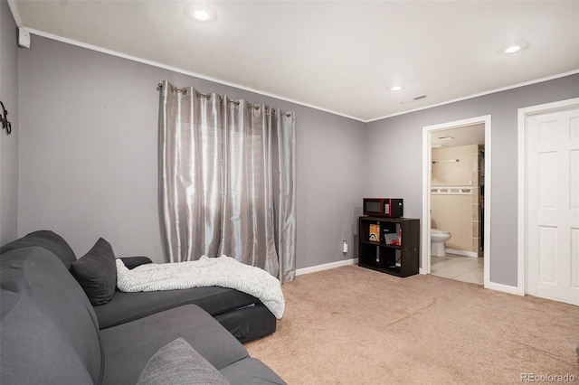 living area with visible vents, light colored carpet, crown molding, and baseboards