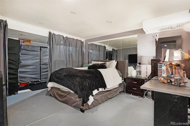 bedroom with concrete flooring