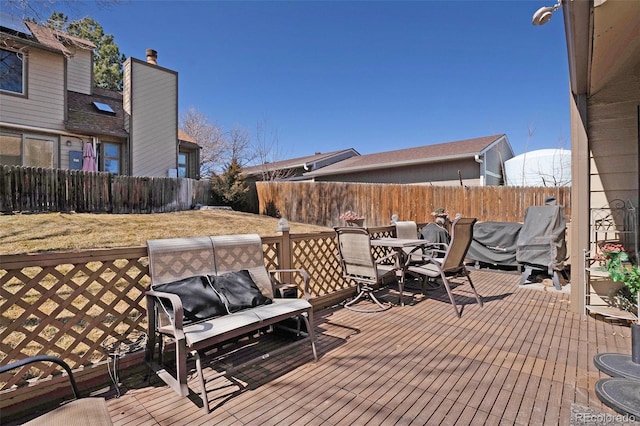 deck with a fenced backyard