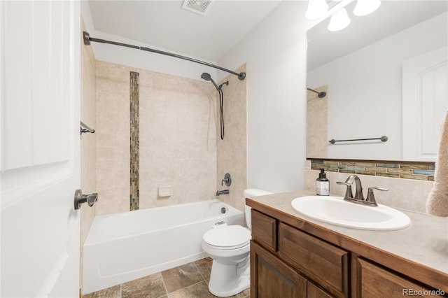 full bathroom featuring toilet, backsplash, vanity, and shower / bath combination