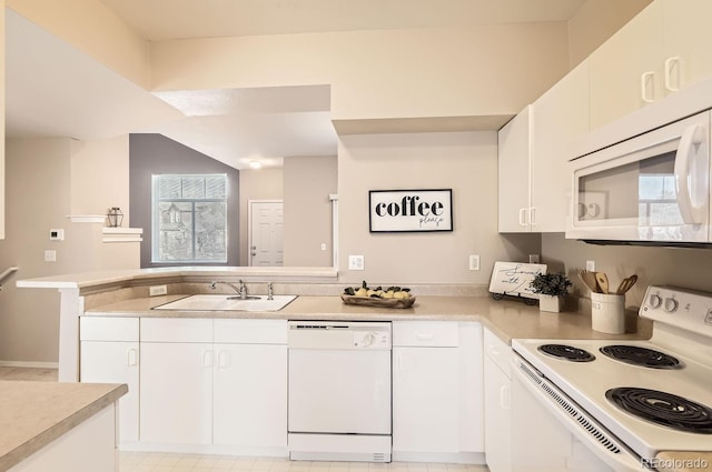 kitchen featuring white cabinetry, white appliances, kitchen peninsula, and sink