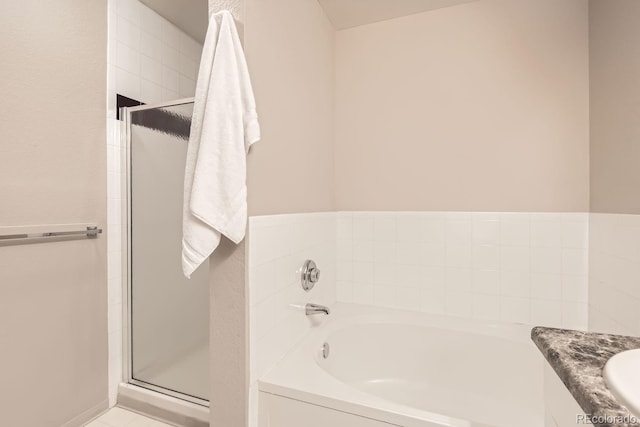 bathroom featuring vanity and separate shower and tub