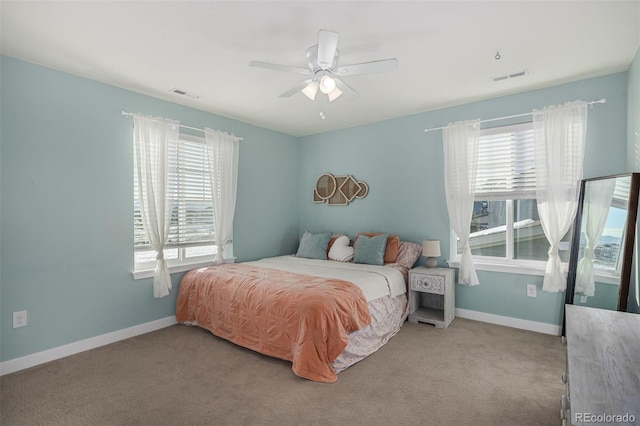 bedroom featuring ceiling fan and light carpet