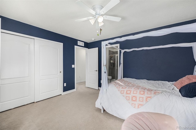 carpeted bedroom with a closet and ceiling fan