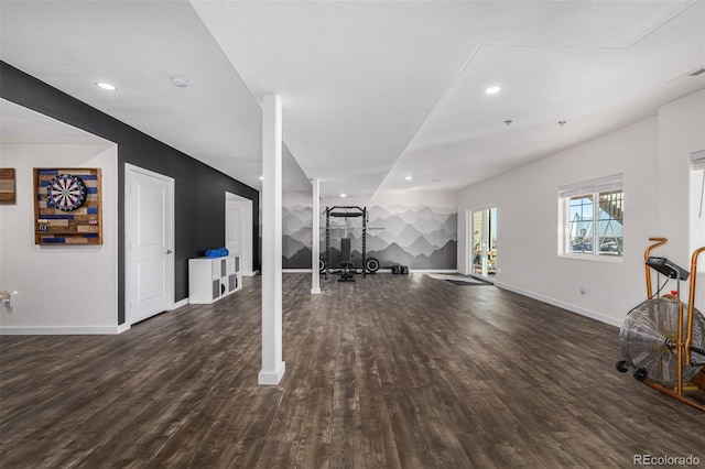 exercise room with dark wood-type flooring