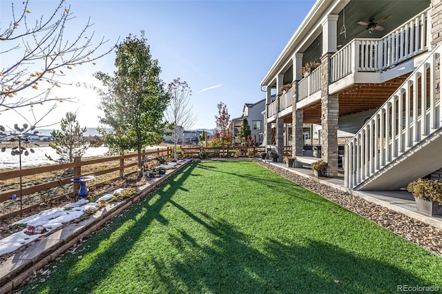 view of yard featuring ceiling fan