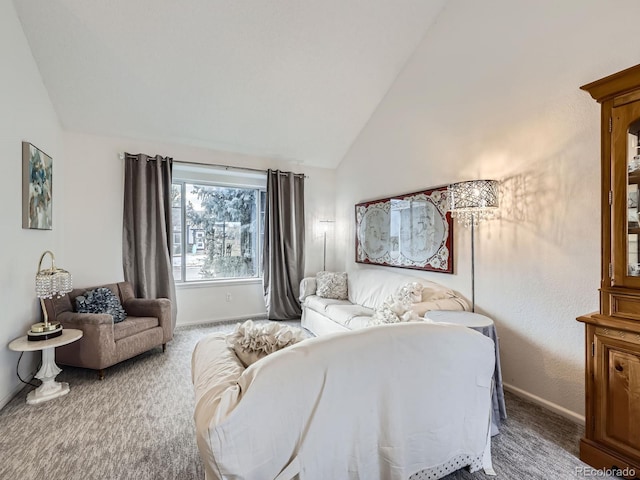 carpeted bedroom featuring lofted ceiling