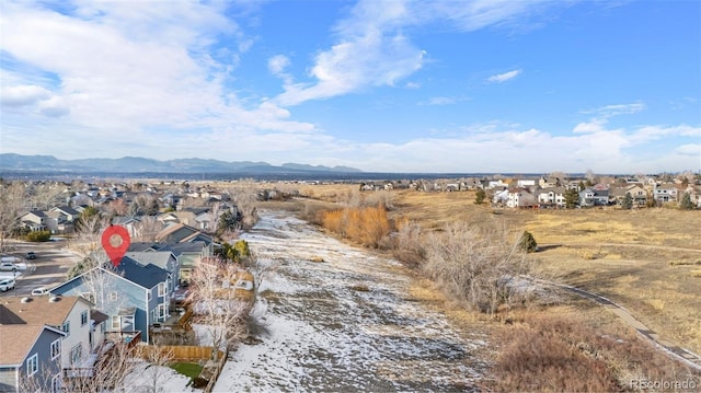 birds eye view of property with a mountain view