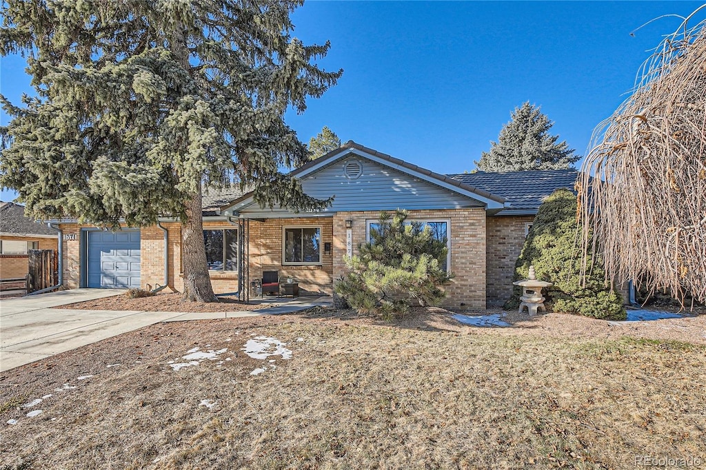 ranch-style house featuring a garage