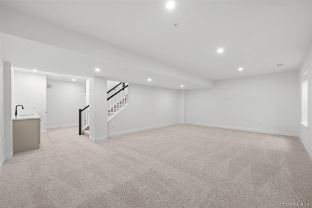 11341 W Alder Dr, Littleton, CO 80127 - finished basement featuring recessed lighting, stairway, and light colored carpet