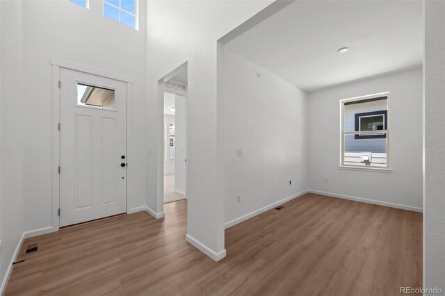 11341 W Alder Dr, Littleton, CO 80127 - entrance foyer with light wood-type flooring and baseboards