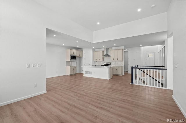 11341 W Alder Dr, Littleton, CO 80127 - unfurnished living room featuring light wood finished floors and recessed lighting
