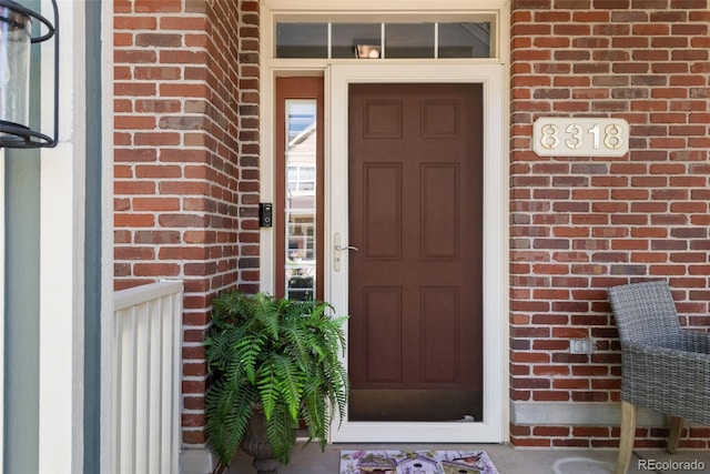 8318 Devinney Ct, Arvada, CO 80005 - view of exterior entry with brick siding