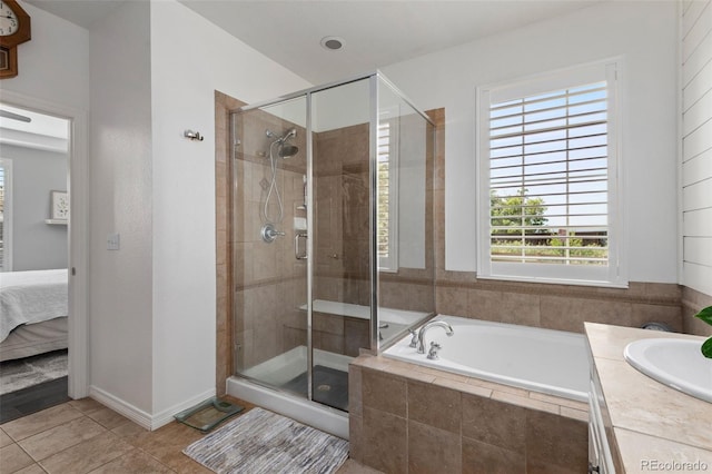 8318 Devinney Ct, Arvada, CO 80005 - full bath with a bath, a shower stall, tile patterned floors, ensuite bath, and vanity