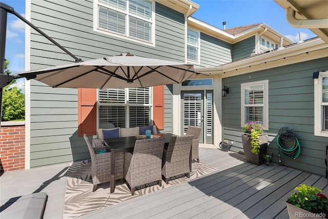 8318 Devinney Ct, Arvada, CO 80005 - wooden terrace with outdoor dining space