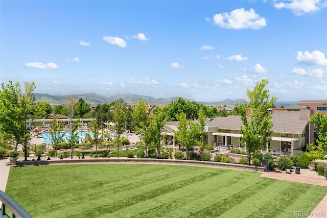 8318 Devinney Ct, Arvada, CO 80005 - surrounding community featuring a mountain view and a yard