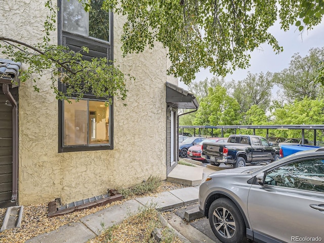 view of side of home with a carport