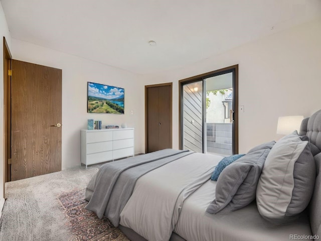 bedroom featuring carpet flooring and access to outside