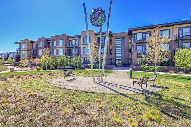view of property's community with a lawn
