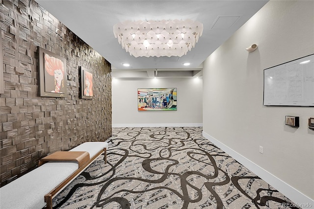 hall with baseboards and recessed lighting