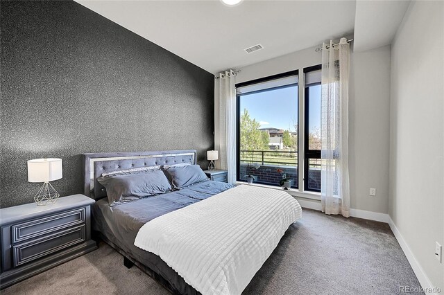 bedroom with visible vents, carpet, and baseboards