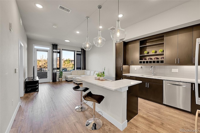 6619 E Lowry Blvd Unit 112, Denver, CO 80230 - kitchen featuring stainless steel dishwasher, a sink, open shelves, dark brown cabinetry, and recessed lighting