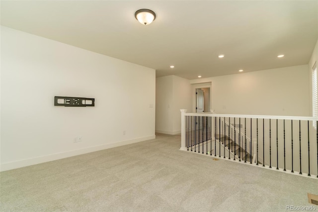 unfurnished room featuring baseboards, carpet flooring, and recessed lighting