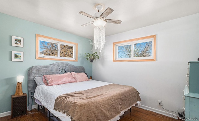 7887 Quivas Way, Denver, CO 80221 - bedroom featuring multiple windows, wood finished floors, and ceiling fan