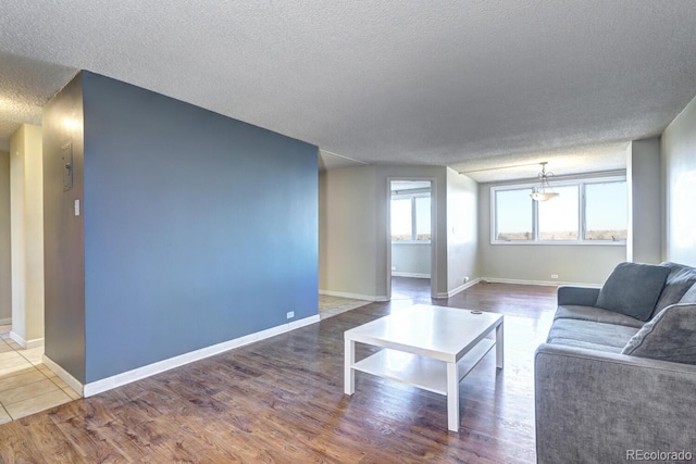 living room featuring hardwood / wood-style floors and a textured ceiling