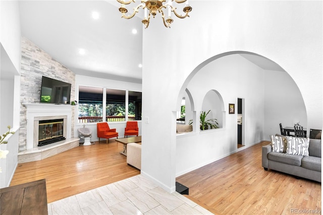 3253 S King Way, Denver, CO 80236 - living area with high vaulted ceiling, a fireplace, a chandelier, and recessed lighting
