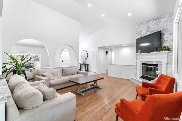 3253 S King Way, Denver, CO 80236 - living area with high vaulted ceiling, a fireplace, light wood-style flooring, and recessed lighting