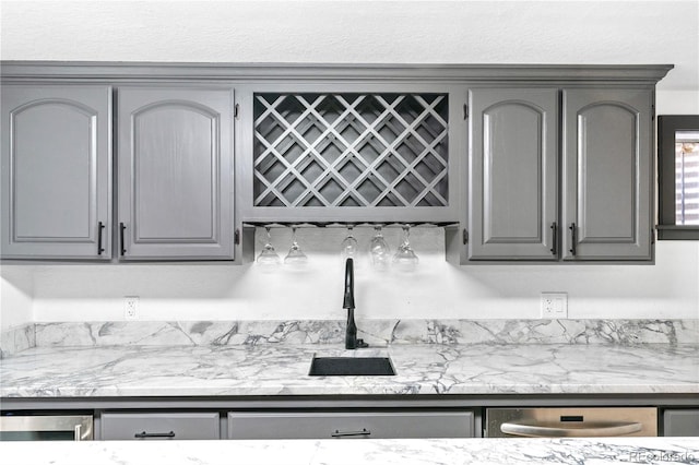 3253 S King Way, Denver, CO 80236 - kitchen with gray cabinets, a sink, and stainless steel dishwasher