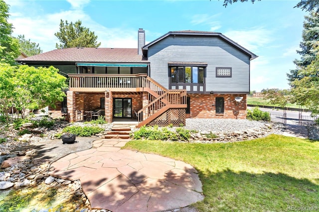 3253 S King Way, Denver, CO 80236 - rear view of property with stairs, a deck, brick siding, a chimney, and a patio